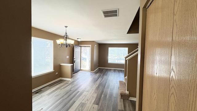 2434 Roxbury Ln, Montgomery, IL 60538 - unfurnished dining area with wood finished floors, a chandelier, and stairway