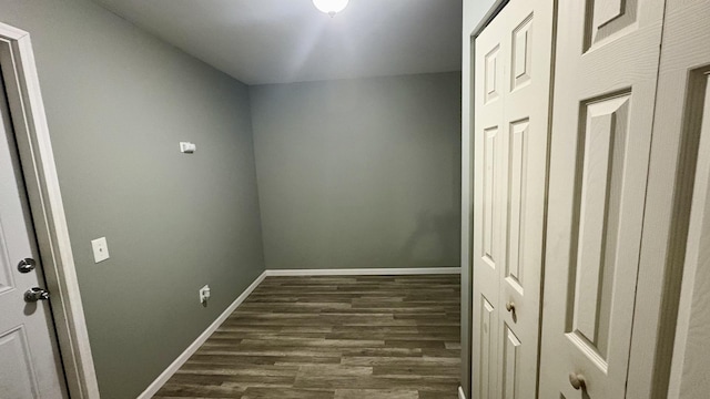 2434 Roxbury Ln, Montgomery, IL 60538 - laundry room featuring dark wood-style floors and baseboards