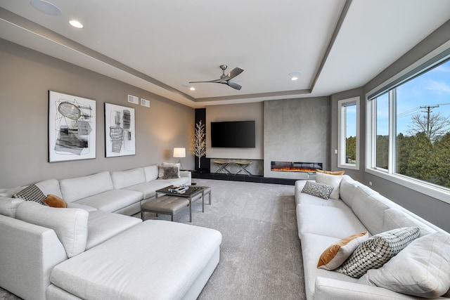2412 Sharon Ct, Naperville, IL 60564 - living room featuring a tray ceiling, recessed lighting, carpet floors, and a ceiling fan