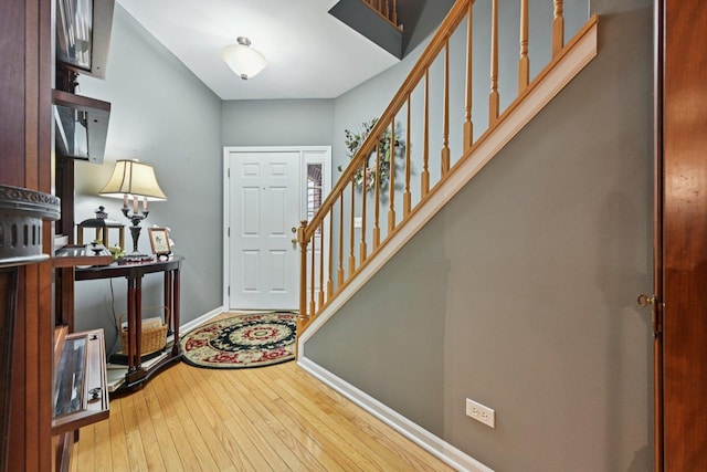 147 Fulbright Ln, Schaumburg, IL 60194 - entryway featuring wood-type flooring and stairs