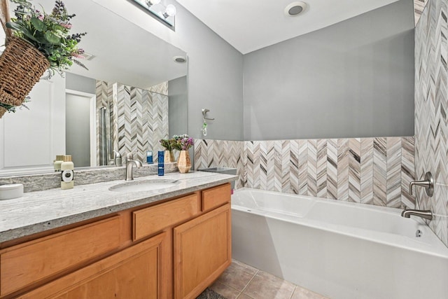 147 Fulbright Ln, Schaumburg, IL 60194 - bathroom featuring a garden tub, vanity, and tile patterned flooring