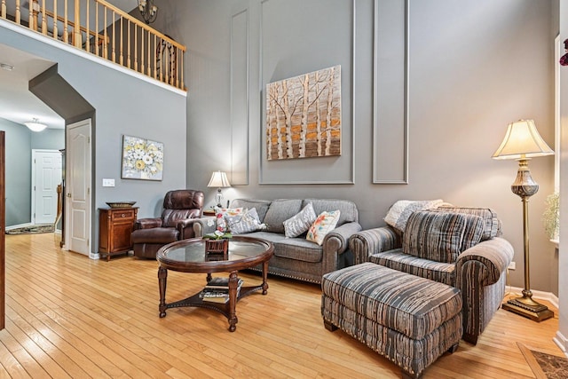 147 Fulbright Ln, Schaumburg, IL 60194 - living room featuring a towering ceiling and wood-type flooring
