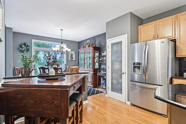 147 Fulbright Ln, Schaumburg, IL 60194 - kitchen with stainless steel refrigerator with ice dispenser, light wood-type flooring, a chandelier, light brown cabinets, and pendant lighting
