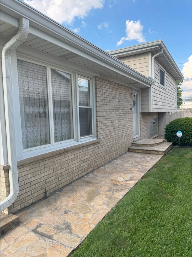 1517 Webster Ln, Des Plaines, IL 60018 - exterior space with brick siding, a yard, and a patio area