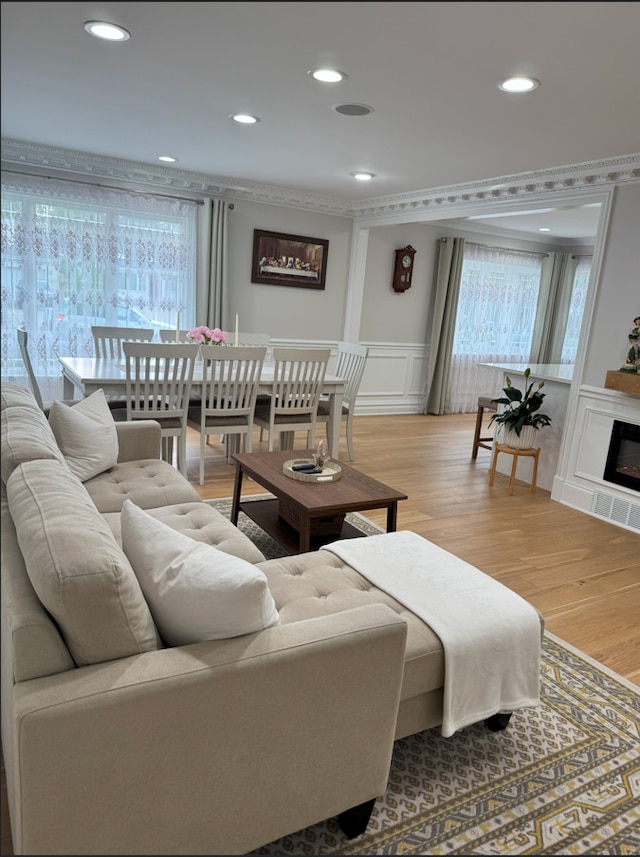 1517 Webster Ln, Des Plaines, IL 60018 - living area featuring light wood-style floors, recessed lighting, a wainscoted wall, ornamental molding, and a decorative wall
