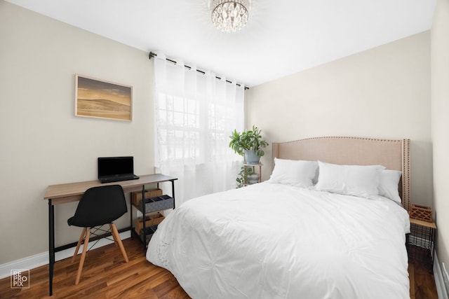 7312 Winthrop Way Unit 11, Downers Grove, IL 60516 - bedroom featuring wood finished floors, a desk, and a chandelier