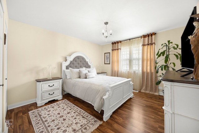7312 Winthrop Way Unit 11, Downers Grove, IL 60516 - bedroom with a chandelier and dark wood-style flooring