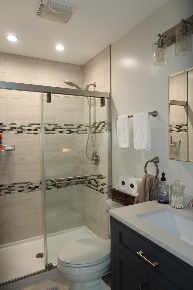 5125 N La Crosse Ave, Chicago, IL 60630 - bathroom with vanity, a stall shower, and recessed lighting
