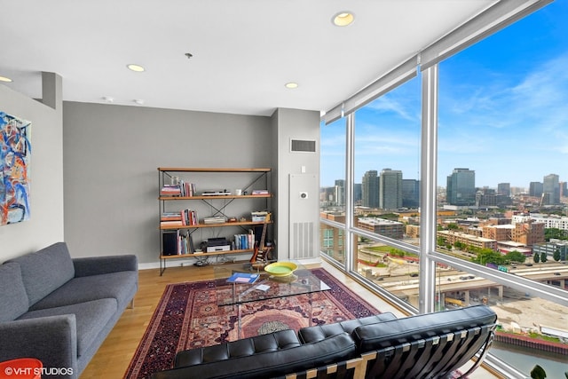 653 N Kingsbury St Unit 2202, Chicago, IL 60654 - living room with wood finished floors, a city view, floor to ceiling windows, and recessed lighting