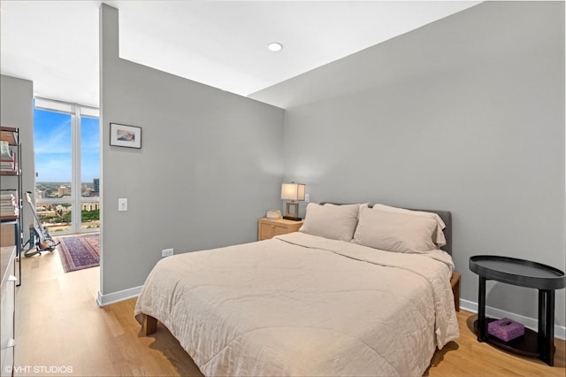 653 N Kingsbury St Unit 2202, Chicago, IL 60654 - bedroom featuring light wood finished floors and expansive windows