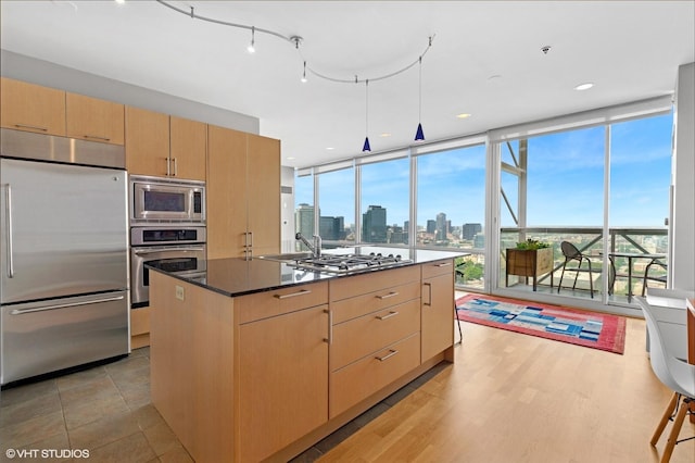 653 N Kingsbury St Unit 2202, Chicago, IL 60654 - kitchen with built in appliances, light brown cabinets, a skyline view, expansive windows, and a kitchen island