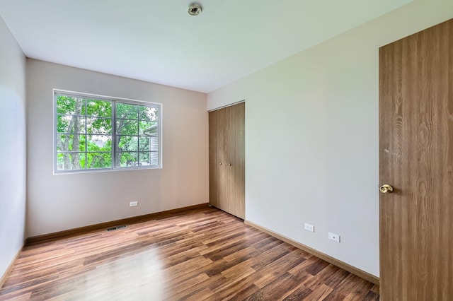 28 W Pheasant Trl Unit 28, Lake In The Hills, IL 60156 - unfurnished room featuring wood finished floors and baseboards