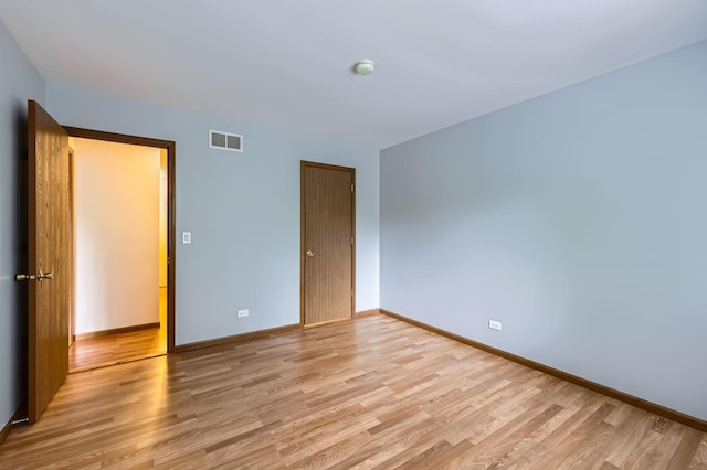28 W Pheasant Trl Unit 28, Lake In The Hills, IL 60156 - unfurnished bedroom with light wood-type flooring and a closet