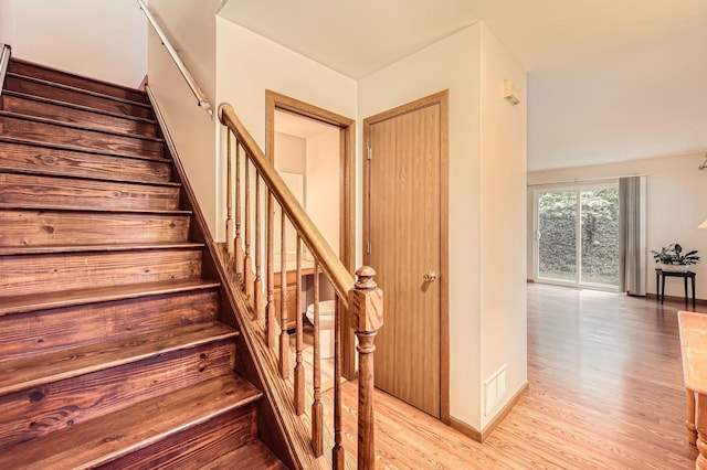 28 W Pheasant Trl Unit 28, Lake In The Hills, IL 60156 - stairway featuring wood finished floors