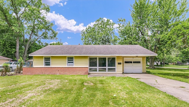 1413 Garden Hills Dr, Champaign, IL 61821 - view of front facade featuring a garage, concrete driveway, a front lawn, and brick siding