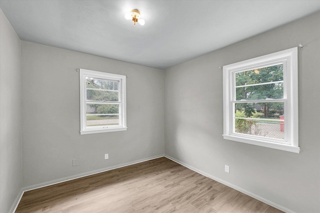 1413 Garden Hills Dr, Champaign, IL 61821 - unfurnished room with light wood-style flooring and baseboards