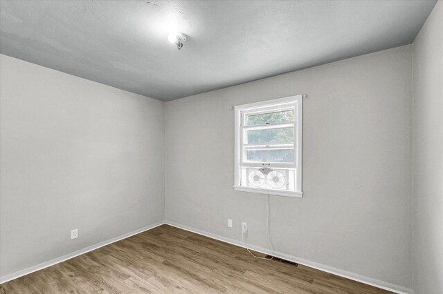 1413 Garden Hills Dr, Champaign, IL 61821 - empty room with wood finished floors and baseboards