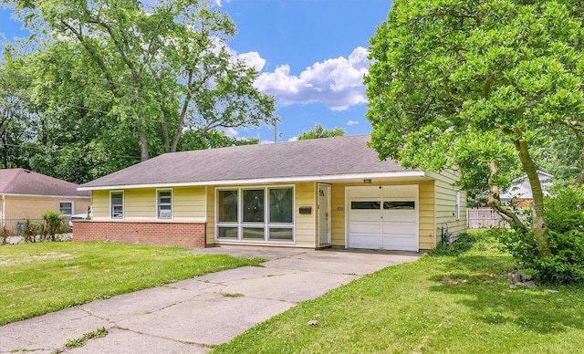 1413 Garden Hills Dr, Champaign, IL 61821 - view of front of house with a garage, driveway, brick siding, and roof with shingles