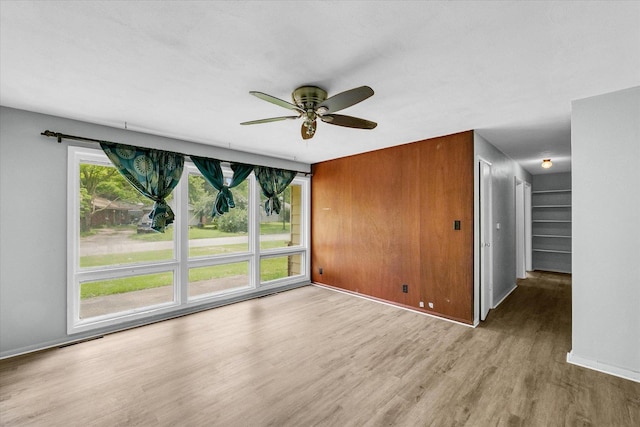1413 Garden Hills Dr, Champaign, IL 61821 - unfurnished room with wood finished floors and a ceiling fan
