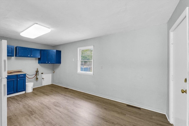 1413 Garden Hills Dr, Champaign, IL 61821 - laundry room with wood finished floors and baseboards