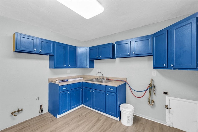 1413 Garden Hills Dr, Champaign, IL 61821 - laundry area with hookup for a gas dryer, light wood-style flooring, washer hookup, and cabinet space