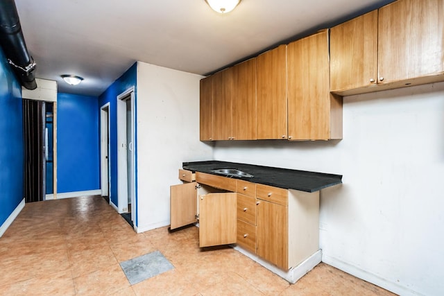 6455 S Marshfield Ave, Chicago, IL 60636 - kitchen featuring baseboards and dark countertops