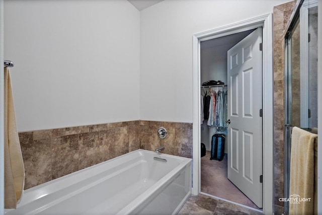 433 Davis Dr, Sycamore, IL 60178 - full bathroom featuring a garden tub, a walk in closet, and a shower stall