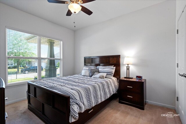 433 Davis Dr, Sycamore, IL 60178 - bedroom featuring light colored carpet and a ceiling fan