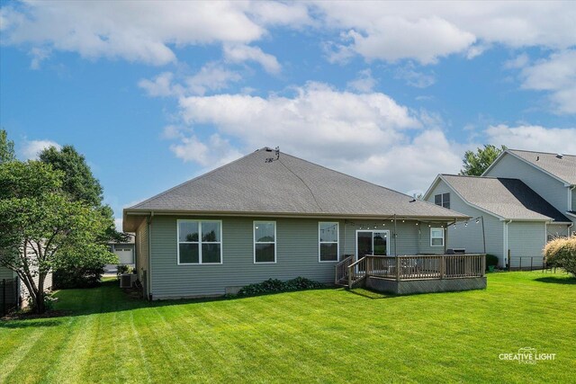 433 Davis Dr, Sycamore, IL 60178 - rear view of property with a lawn and a wooden deck