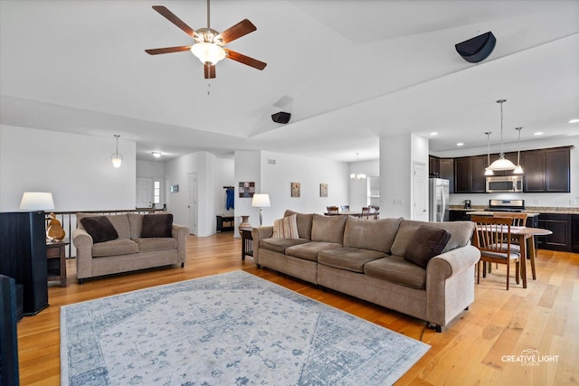 433 Davis Dr, Sycamore, IL 60178 - living area featuring ceiling fan, light wood-style floors, recessed lighting, a chandelier, and high vaulted ceiling