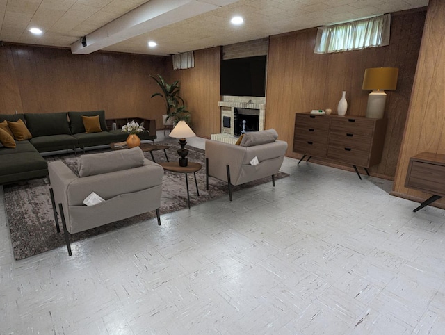 1437 S Plum Ave, Freeport, IL 61032 - living room featuring wood walls, recessed lighting, and a fireplace
