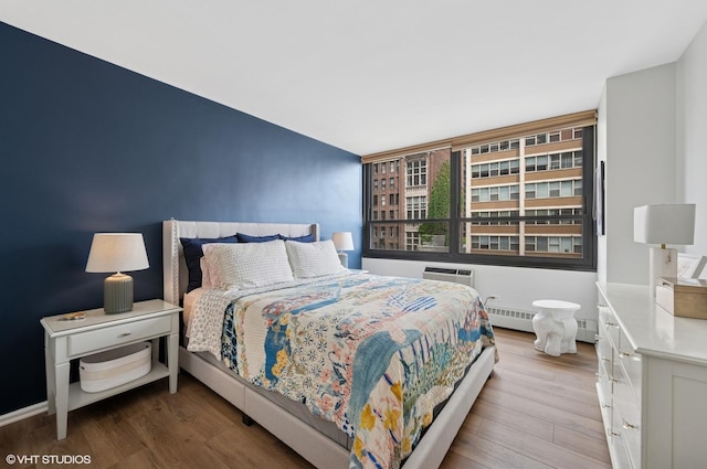 33 E Cedar St Unit 8G, Chicago, IL 60611 - bedroom featuring wood finished floors and baseboard heating