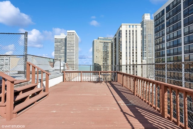 33 E Cedar St Unit 8G, Chicago, IL 60611 - wooden deck with a view of city