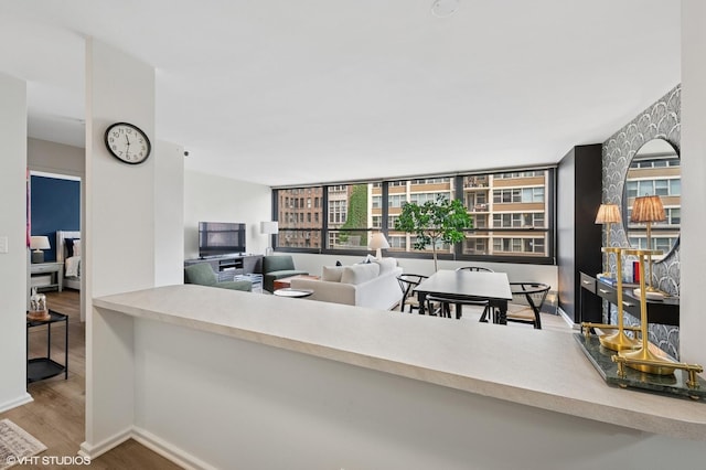 33 E Cedar St Unit 8G, Chicago, IL 60611 - kitchen with wood finished floors and an office area