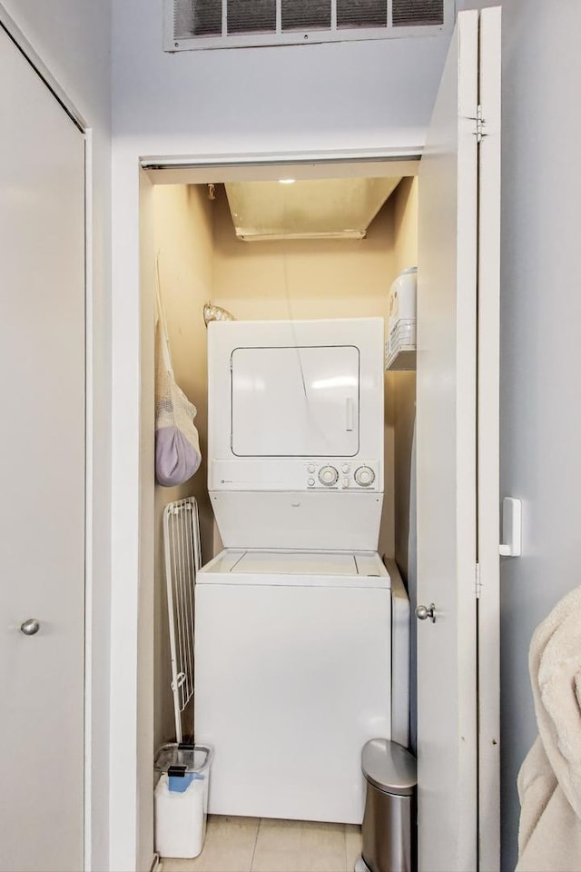 1530 S State St Unit 14O, Chicago, IL 60605 - laundry room featuring stacked washer / drying machine and light tile patterned floors