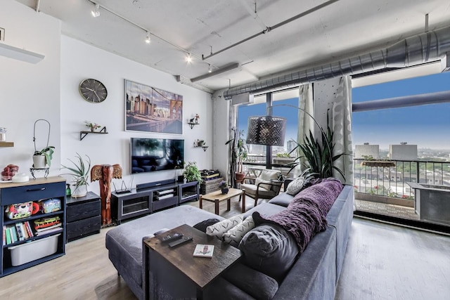 1530 S State St Unit 14O, Chicago, IL 60605 - living room with wood finished floors and track lighting