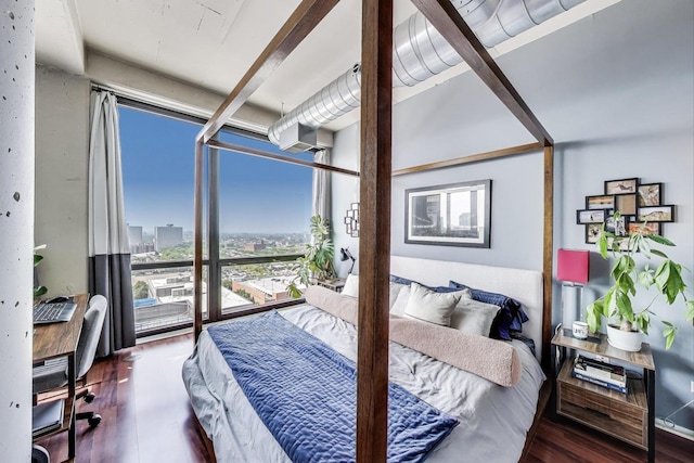 1530 S State St Unit 14O, Chicago, IL 60605 - bedroom with wood finished floors, a desk, and a city view