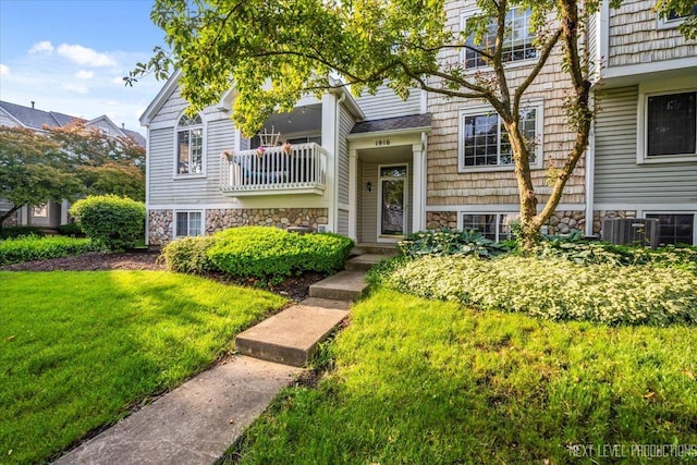 1916 Middlebury Dr Unit 1916, Aurora, IL 60503 - view of front of home featuring stone siding and a front yard