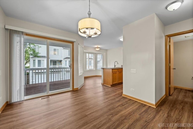 1916 Middlebury Dr Unit 1916, Aurora, IL 60503 - empty room with wood finished floors and baseboards
