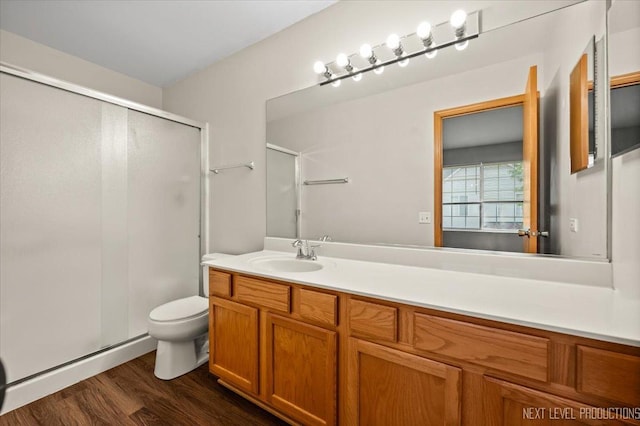 1916 Middlebury Dr Unit 1916, Aurora, IL 60503 - bathroom featuring a stall shower, vanity, and wood finished floors