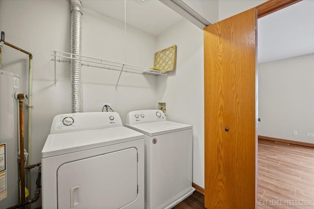 1916 Middlebury Dr Unit 1916, Aurora, IL 60503 - laundry area featuring washing machine and clothes dryer, water heater, and wood finished floors