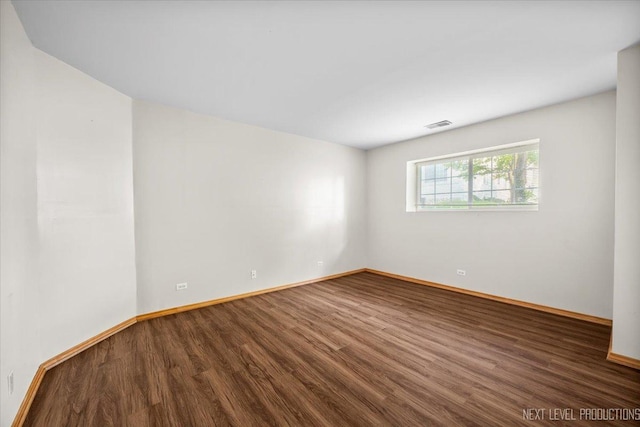 1916 Middlebury Dr Unit 1916, Aurora, IL 60503 - empty room featuring wood finished floors and baseboards