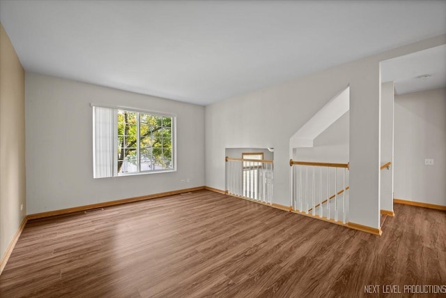 1916 Middlebury Dr Unit 1916, Aurora, IL 60503 - empty room with wood finished floors and baseboards