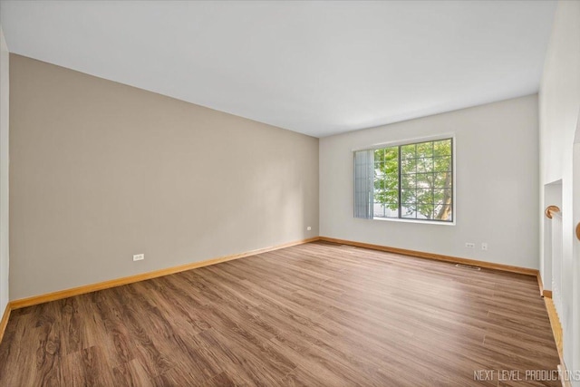 1916 Middlebury Dr Unit 1916, Aurora, IL 60503 - spare room featuring wood finished floors