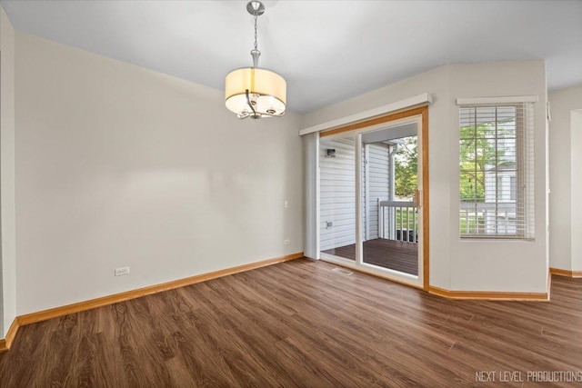 1916 Middlebury Dr Unit 1916, Aurora, IL 60503 - empty room with wood finished floors and a chandelier