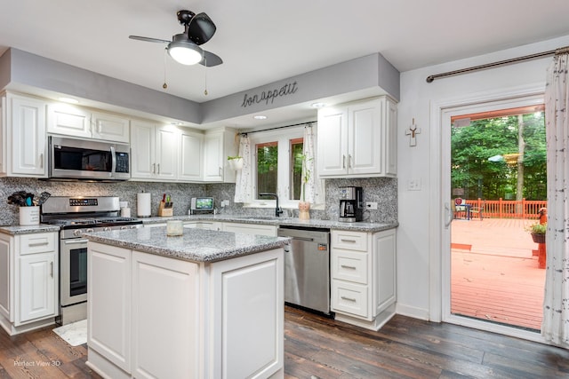 20131 E Brightway Dr, Mokena, IL 60448 - kitchen featuring appliances with stainless steel finishes, backsplash, white cabinetry, and dark wood finished floors