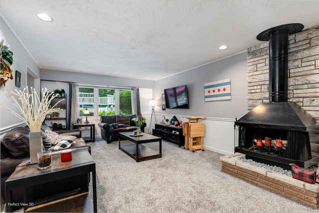 20131 E Brightway Dr, Mokena, IL 60448 - carpeted living area with a wood stove, a textured ceiling, and recessed lighting