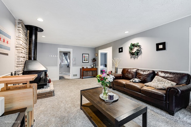 20131 E Brightway Dr, Mokena, IL 60448 - carpeted living room featuring a wood stove, recessed lighting, and a textured ceiling