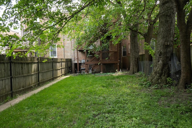 7042 S Carpenter St, Chicago, IL 60621 - fenced backyard featuring a deck
