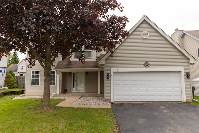 10 Sugar Creek Ct, Lake In The Hills, IL 60156 - view of front of home featuring asphalt driveway, a garage, and a front yard